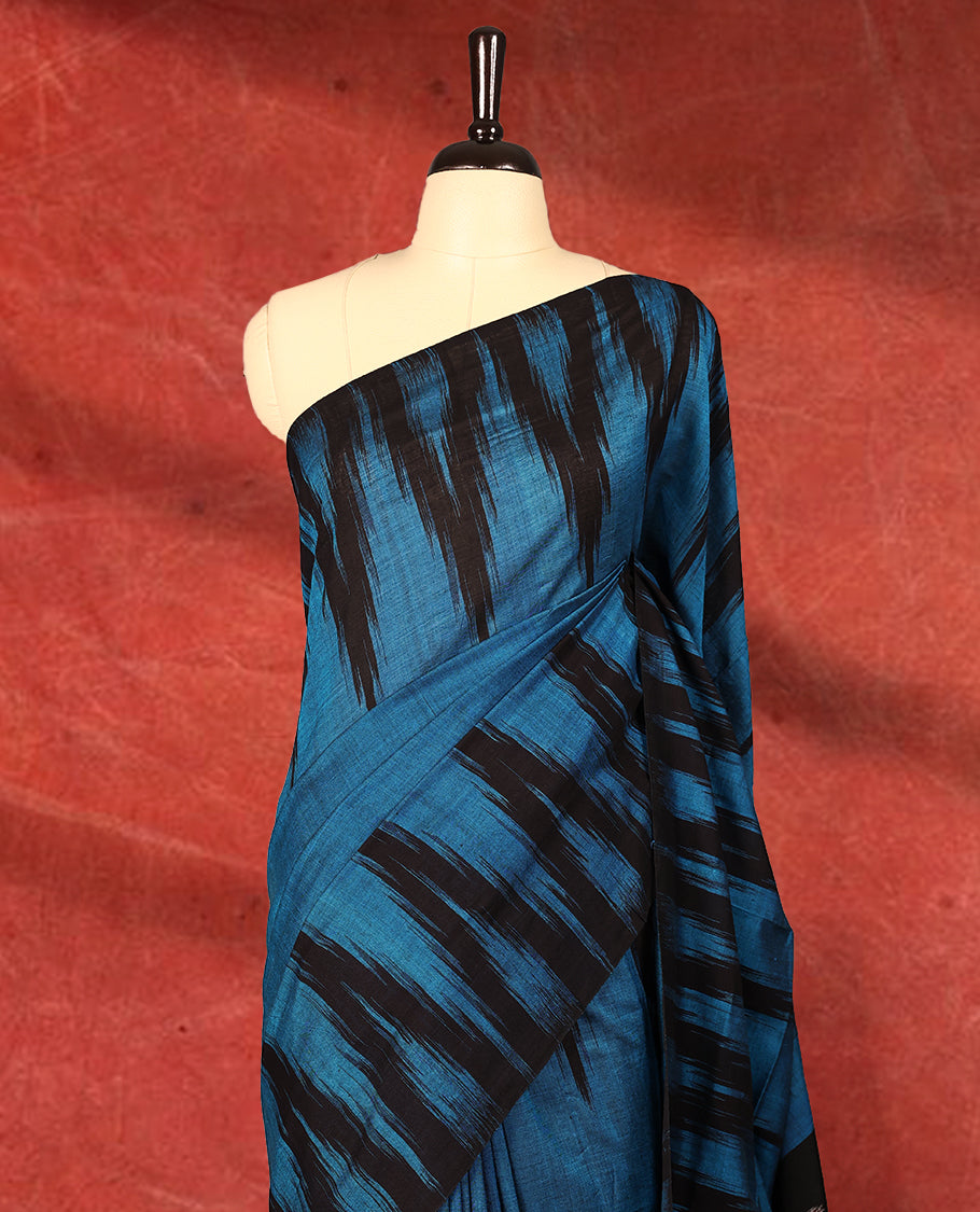 Blue and black colour Ikkat Pochampally saree featuring bold abstract ikkat patterns on the body, traditional geometric ikkat design on the pallu, without Blouse