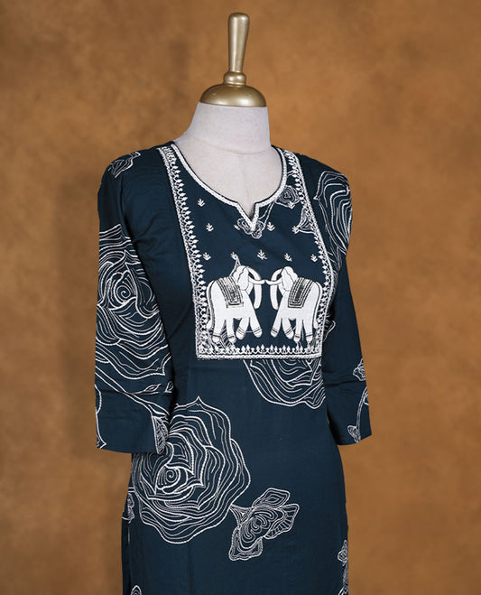 Dark Green colour kurti illustrated with bold white floral outlines and an elephant-themed embroidered yoke, styled with a notched neckline and comfy 3/4th sleeves.