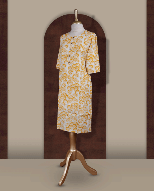 White colour kurthi from TWARA, with beautiful yellow floral prints & Designed with a round neckline, button placket, and 3/4 sleeves.