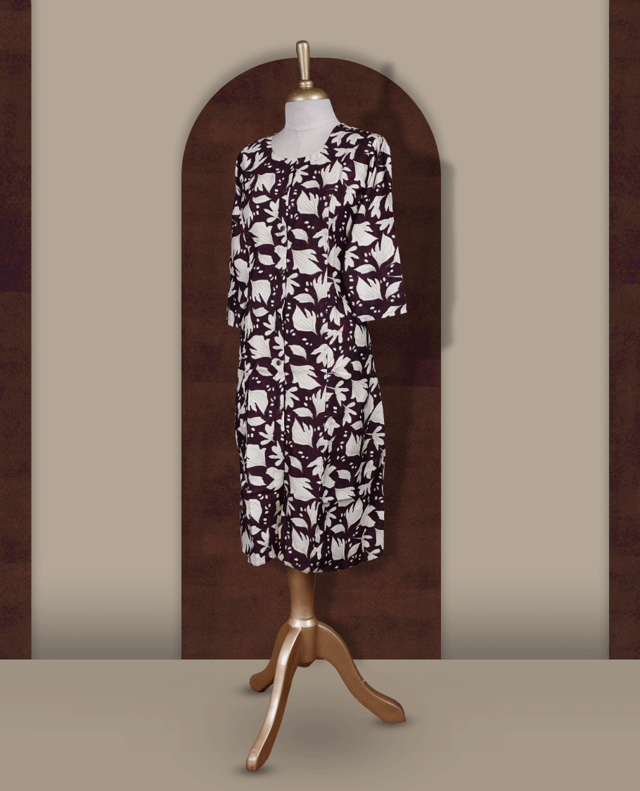 Wine colour kurthi featuring bold off white colour floral prints, a round neckline with front button detailing, and comfortable 3/4th sleeves & Designed in a flattering A line silhouette, perfect for casual outings and everyday elegance.