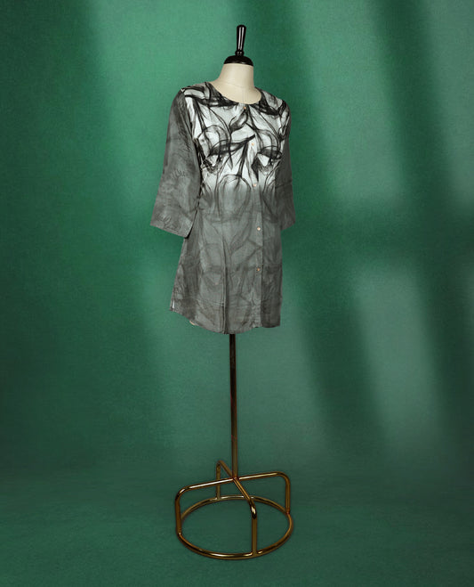 Stylish black and grey short kurti featuring a smoky abstract print, button down front, round neckline, and 3/4th sleeves perfect for a chic casual look.