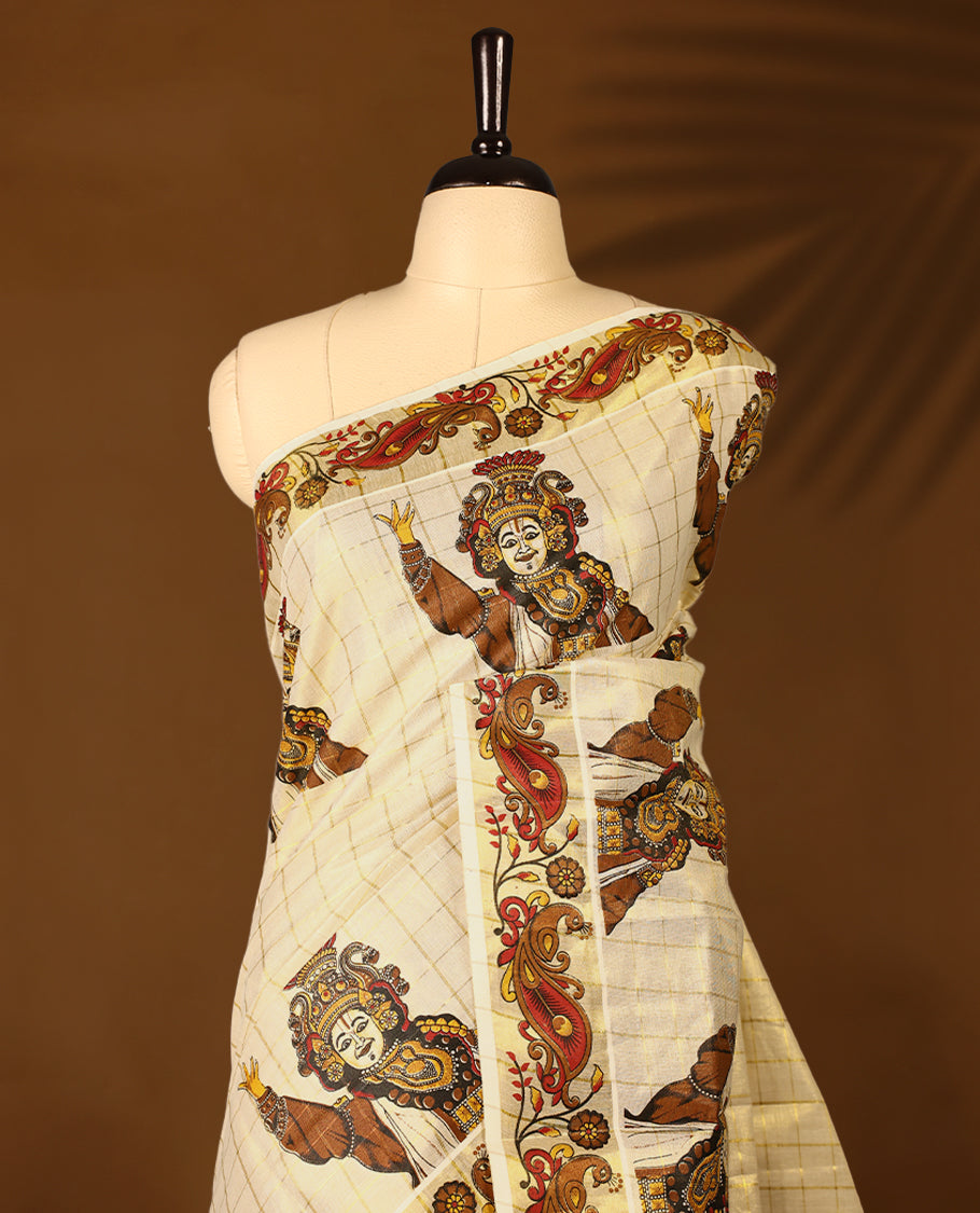 Light Gold colour Tissue Kerala saree featuring Kerala traditioal Prints on checked body and a beautifully woven Gold Kasavu border, paired with a matching blouse perfect for festive occasions.
