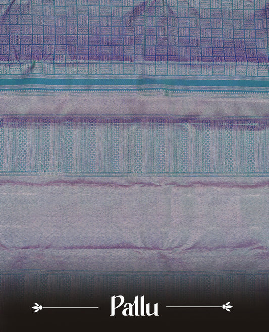 Peacock blue colour Kanchipuram pattern Manthrakodi saree featuring intricate geometric antique copper zari brocade design across the body, beautifully complemented with a matching self brocade blouse piece.