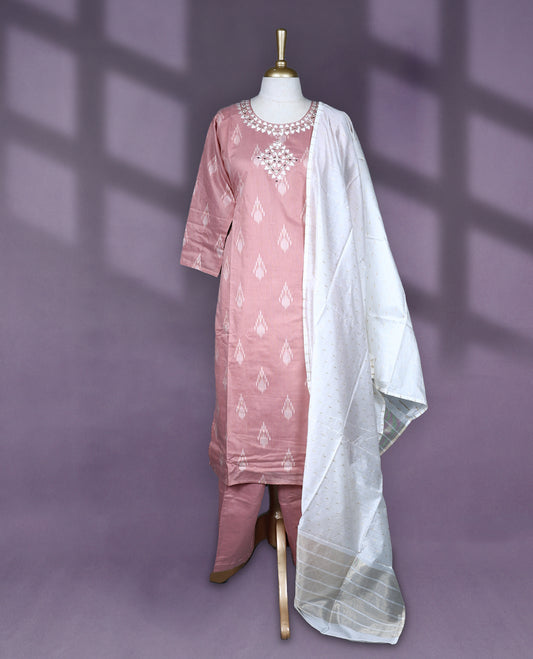Dusty pink colour salwar set featuring ikat style motifs and delicate mirror work on the neckline, paired with matching plain bottom and an elegant off white dupatta with subtle golden thread detailing.