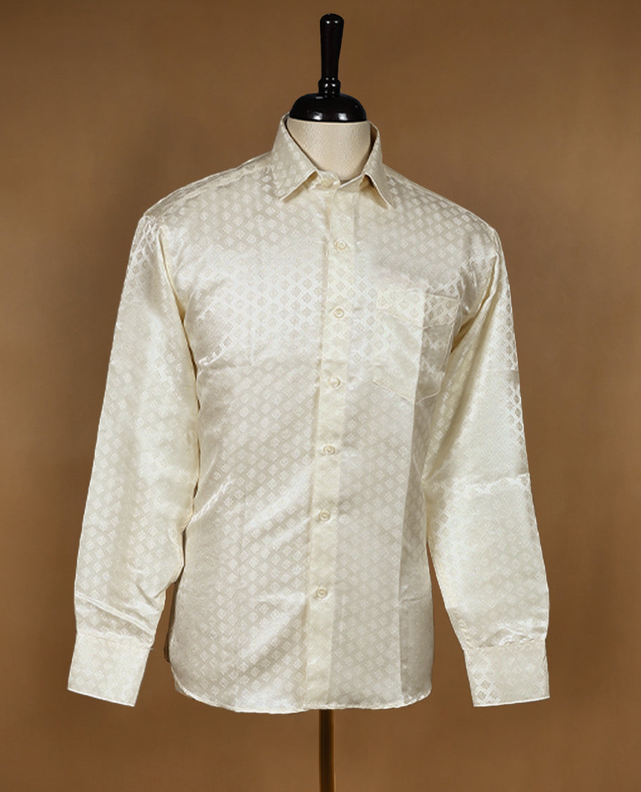 Cream ivory Denim Marton men's wedding shirt with a glossy finish, featuring diamond jacquard self-design, full sleeves, classic collar, and a chest pocket.