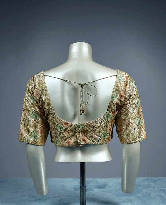 Pastel brocade padded readymade blouse featuring a diamond shaped multicolor weave in soft tones of sage green, peach, and gold, finished with elbow length sleeves and a flattering V neckline