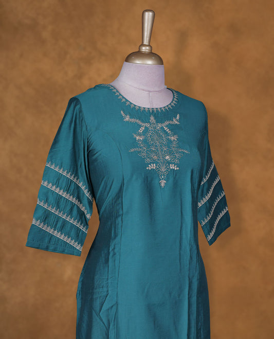 Teal blue colour kurti BY VISMAY with subtle thread embroidery, straight calf length silhouette, featuring a round neckline and stylish three quarter sleeves with striped detailing.