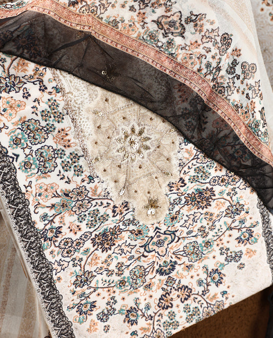 Elegant cream colour churidhar material with intricate floral embroidery on the neckline, paired with a beautifully printed dupatta and a plain matching bottom.
