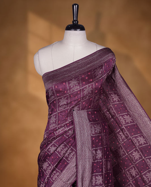 Deep dark purple colour Banarasi Bandhani silk saree featuring with intricate Banarasi motifs on body, complemented by antique zari woven border and grand pallu, paired with matching  blouse