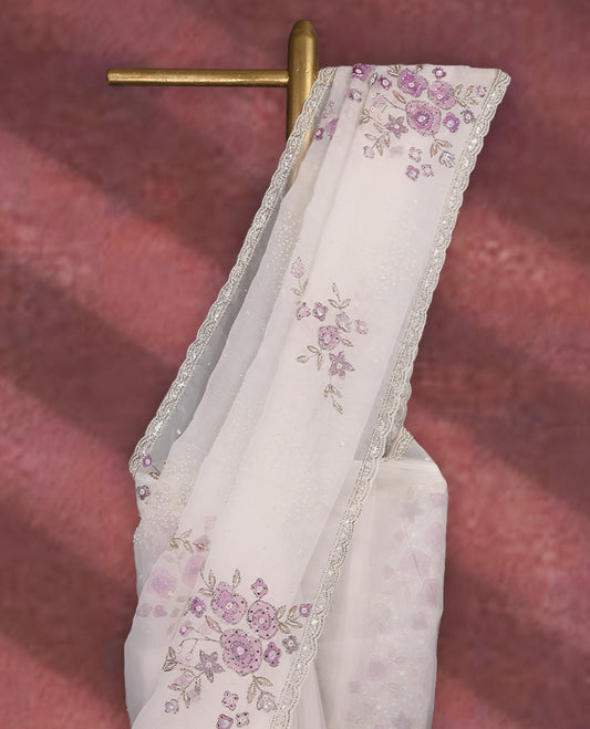 White colour pure organza saree featuring Grape Colour floral prints with intricate bead and sequin work across the body, adorned with a matching embellished border, complemented by a worked pallu and paired with a heavily worked matching blouse.