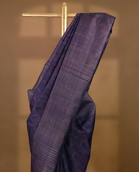 Dark Royal Purple coloured Manthrakodi saree featuring a multicoloured zari jacquard body, complemented by a self coloured turning Banarasi border and a matching self coloured blouse.