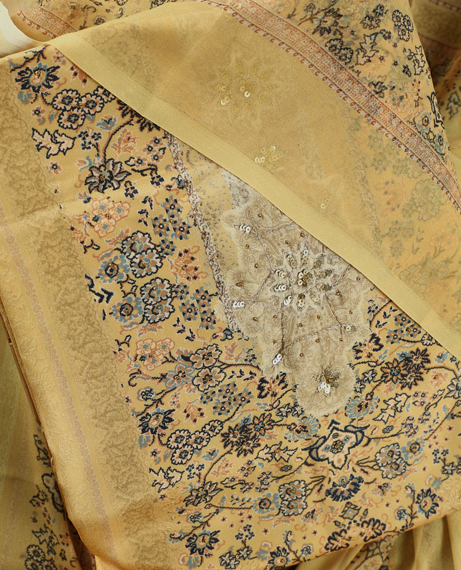 Pastel yellow colour churidhar material with intricate floral prints, sequin embroidery on the top, plain matching bottom, and a coordinated dupatta.