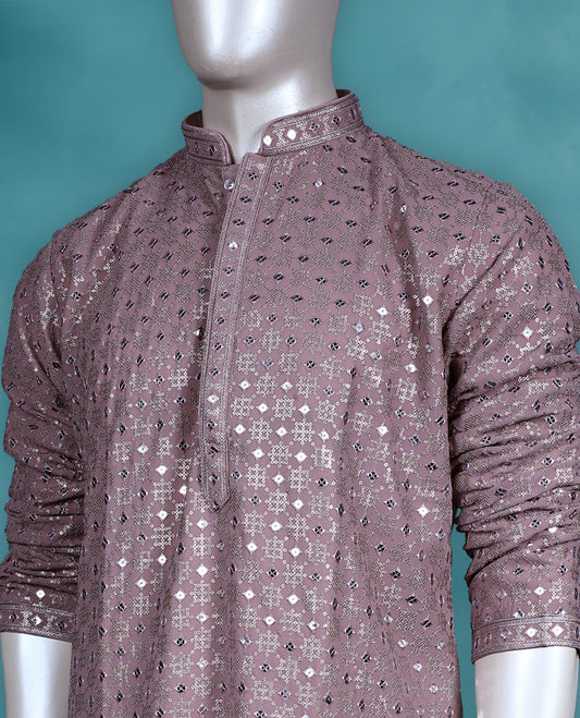 Dark onion colour georgette kurta set featuring thread and sequin work on the body, full sleeves, and paired with a matching bottom.
