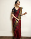Dark Brown and Dark Pinkish Maroon Colour pure Kancheepuram silk saree featuring gold zari elephant & floral brocade border, body with gold checkered patterns and Gold & Silver colour Peacock Motifs, traditional pallu paired with matching blouse