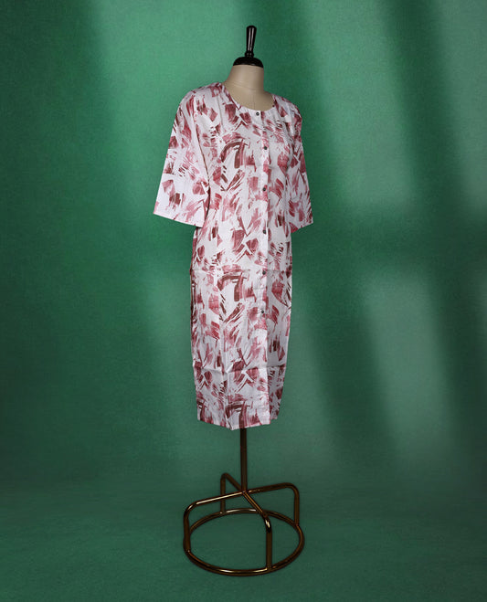 White cotton kurti with abstract Pastel maroon brushstroke prints, featuring a round neckline, front button detailing, and elbow length sleeves a stylish choice for casual daywear.