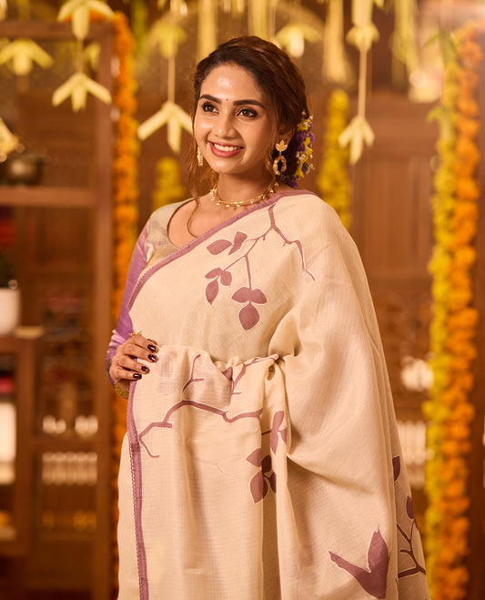 Cream colour Tussar cotton Kota saree featuring delicate Block printed leaves motifs across the body, highlighted with a subtle lavender border, paired with a matching blouse