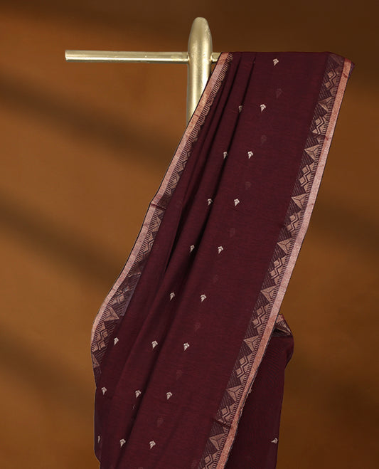 Dark Maroon colour soft khadi cotton saree with small Beige Zari motifs on the body, detailed woven Gold zari border, paired pallu with tussles, with matching blouse.
