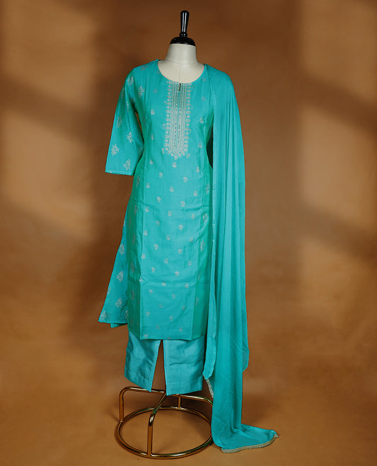 Aqua green colour salwar from TWARA, featuring a round neck adorned with sequins and thread work, with floral prints on the top, paired with a matching bottom and dupatta.
