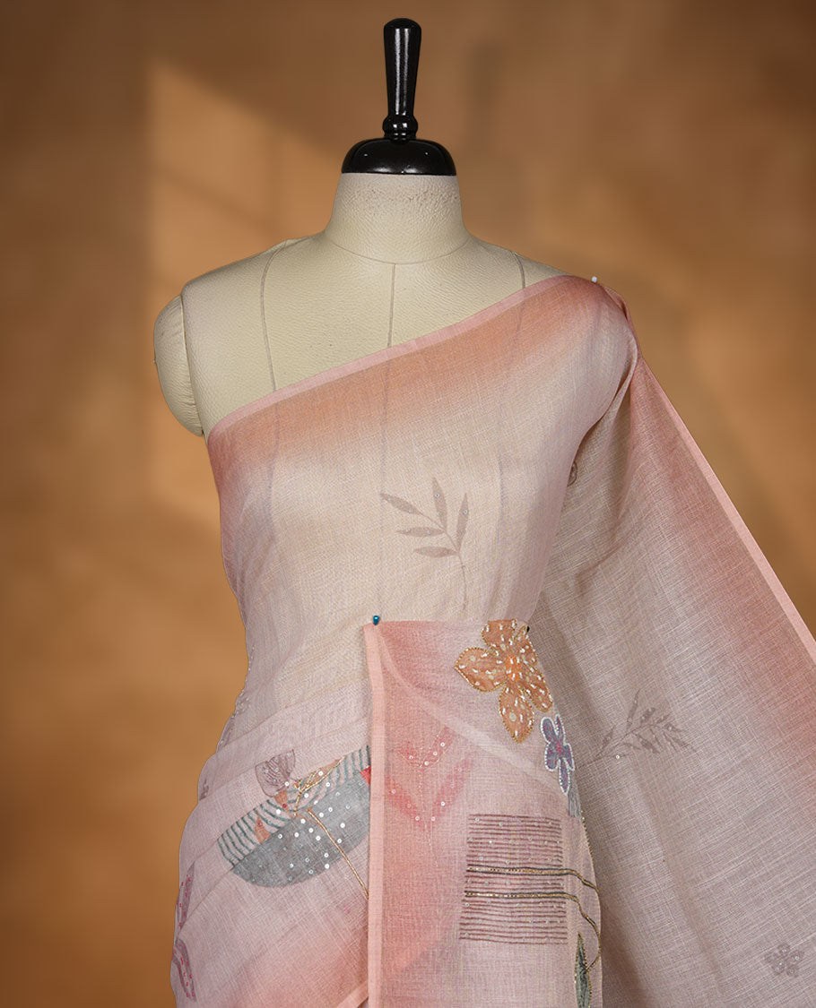 Light peach colour Linen saree featuring Peach colour fade border with floral beats pattern around floral print across body without border, pallu and matching blouse piece.
