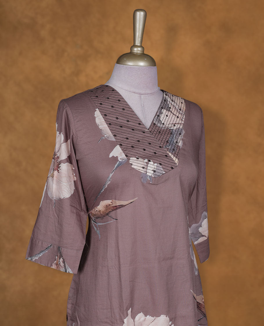 Mauve brown colour kurti BY VISMAY with large floral prints, straight calf length silhouette, styled with a patterned V notch neckline and three quarter sleeves.
