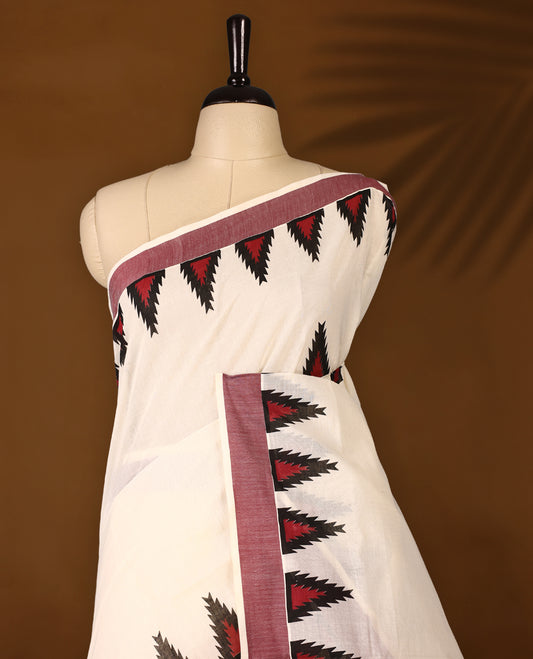 Elegant off white colour cotton Kerala saree featuring Plain body, Maroon colour border with temple designs, Paired with matching blouse offering a classic and graceful look, paired with a matching blouse.