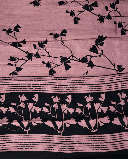 Pastel onion colour semi printed saree featuring black florak kodi prints across the body, finished with a sleek plain border, with matching blouse
