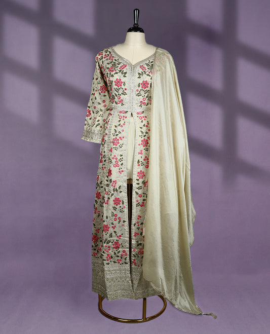 Off white colour kurti set is beautifully adorned with floral embroidery in pink and green tones, The elegant top features a V neckline and three quarter sleeves, complemented by a matching dupatta and bottom.