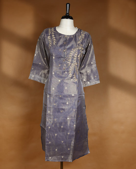 Ash blue colour tissue kurti from TWARA, featuring an intricate golden zari floral kodi pattern, finished with a round neckline and a button-down front placket.