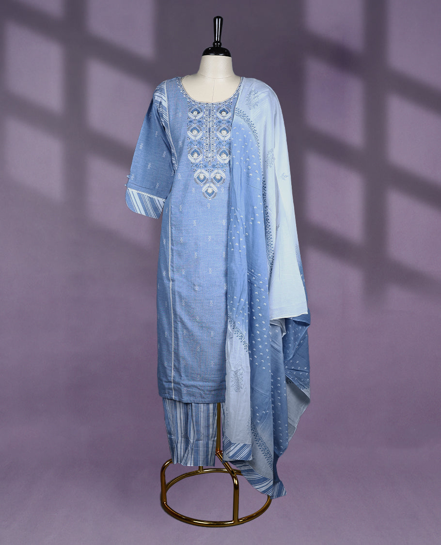 Sky-blue colour ensemble features a round neckline with intricate embroidery and 3/4th sleeves, paired with striped pants and a printed dupatta for a breezy, elegant look.