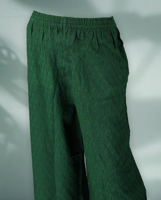 Chic green colour palazzo pants adorned with subtle self embroidery and a wide leg silhouette