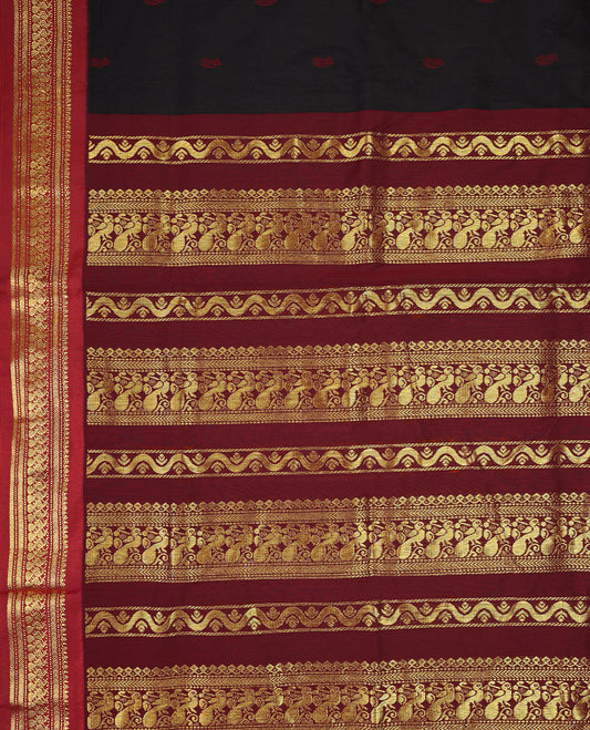 Pure Black colour mixed Kalyani cotton saree featuring Maroon zari motifs throughout the body, paired with a Maroon colour traditional border and pallu, with matching blouse