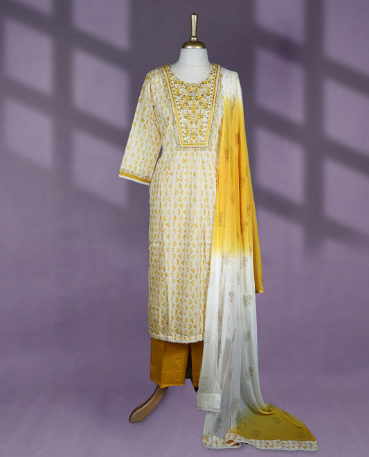 Vibrant yellow and white colour salwar set with bottom, featuring a round neckline with detailed yoke embroidery, three-quarter sleeves, and a beautifully ombre dyed dupatta with gold motifs
