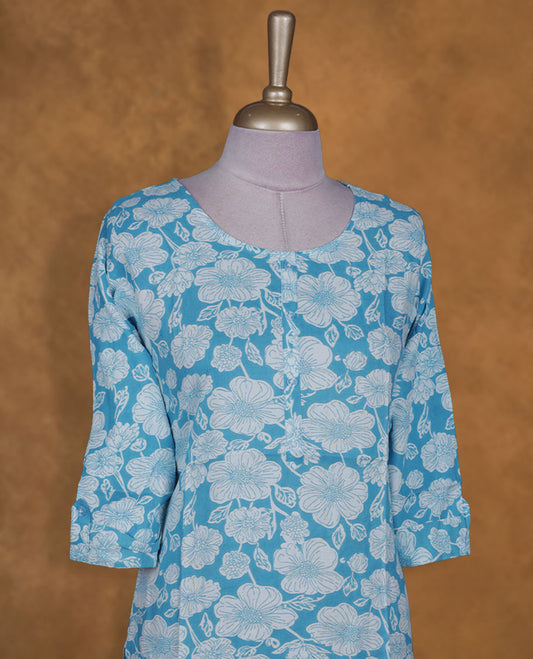 Sky and white colour kurti with White floral prints, knee length design, styled with a round neckline and a sleeve .