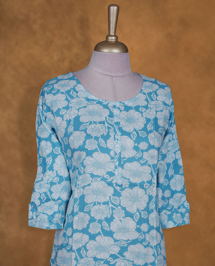 Sky and white colour kurti with White floral prints, knee length design, styled with a round neckline and a sleeve .