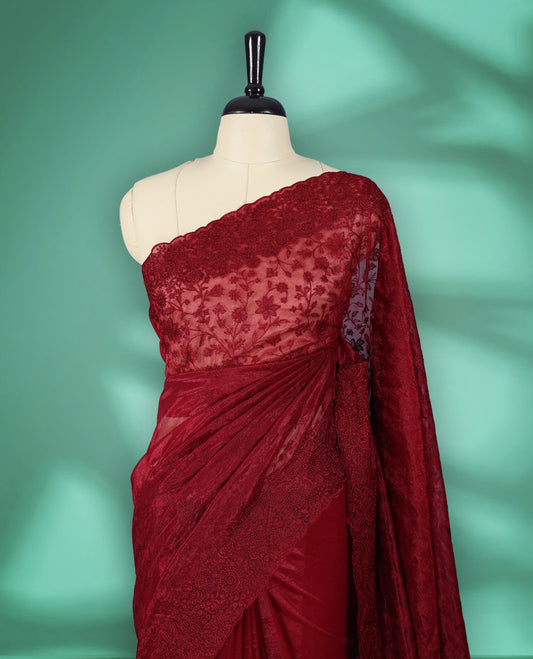Deep Red colour organza fancy saree adorned with intricate all over embroidery work in floral kodi patterns, finished with a matching floral embroidered border, with matching blouse