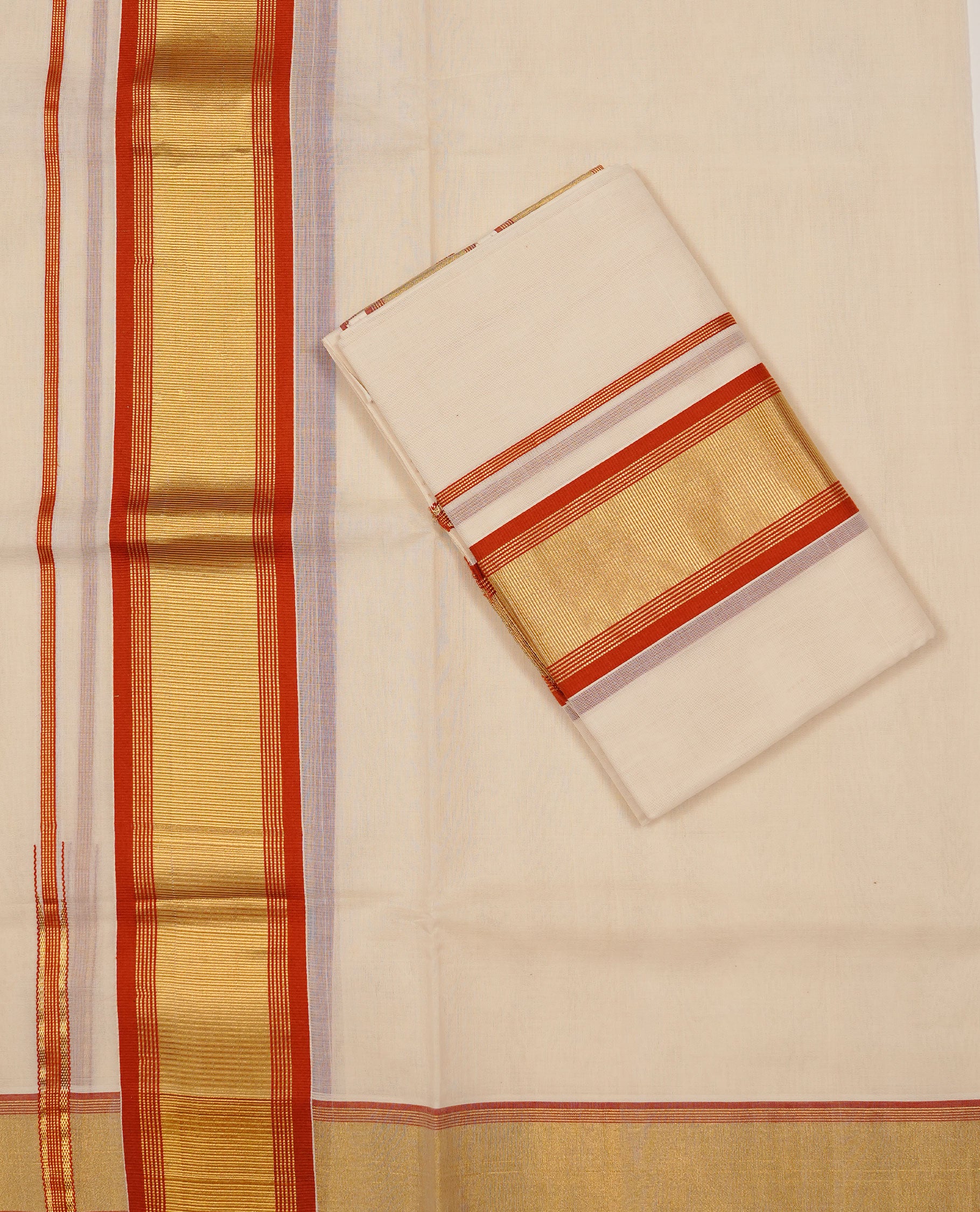 Off white colour Cotton Set Mund featuring a plain body, enhanced by a gold zari border with Brick red stripes.