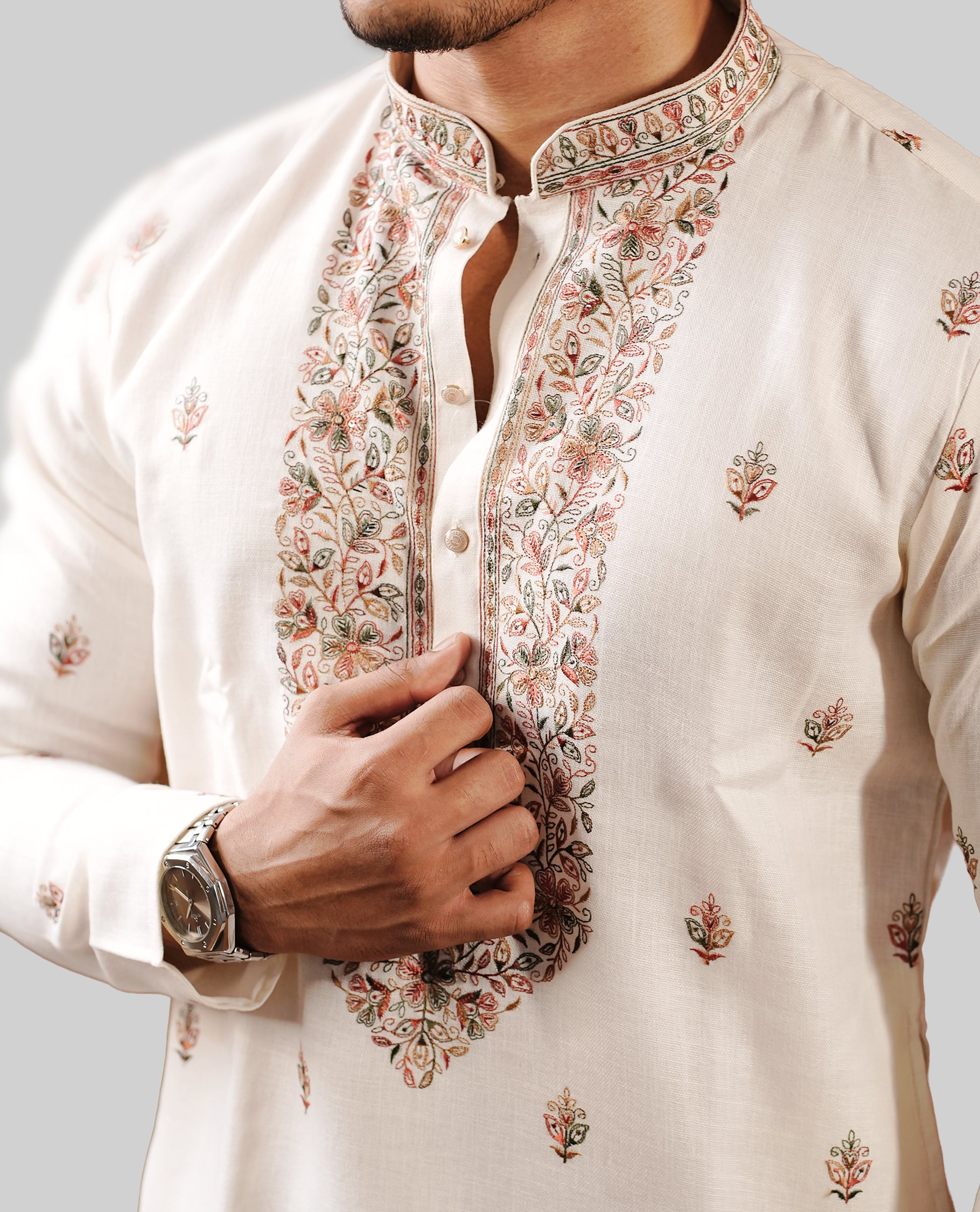 Beige colour men's kurta featuring elegant Multicolour thread and sequins work on the body, complemented by full sleeves for a refined and festive look.