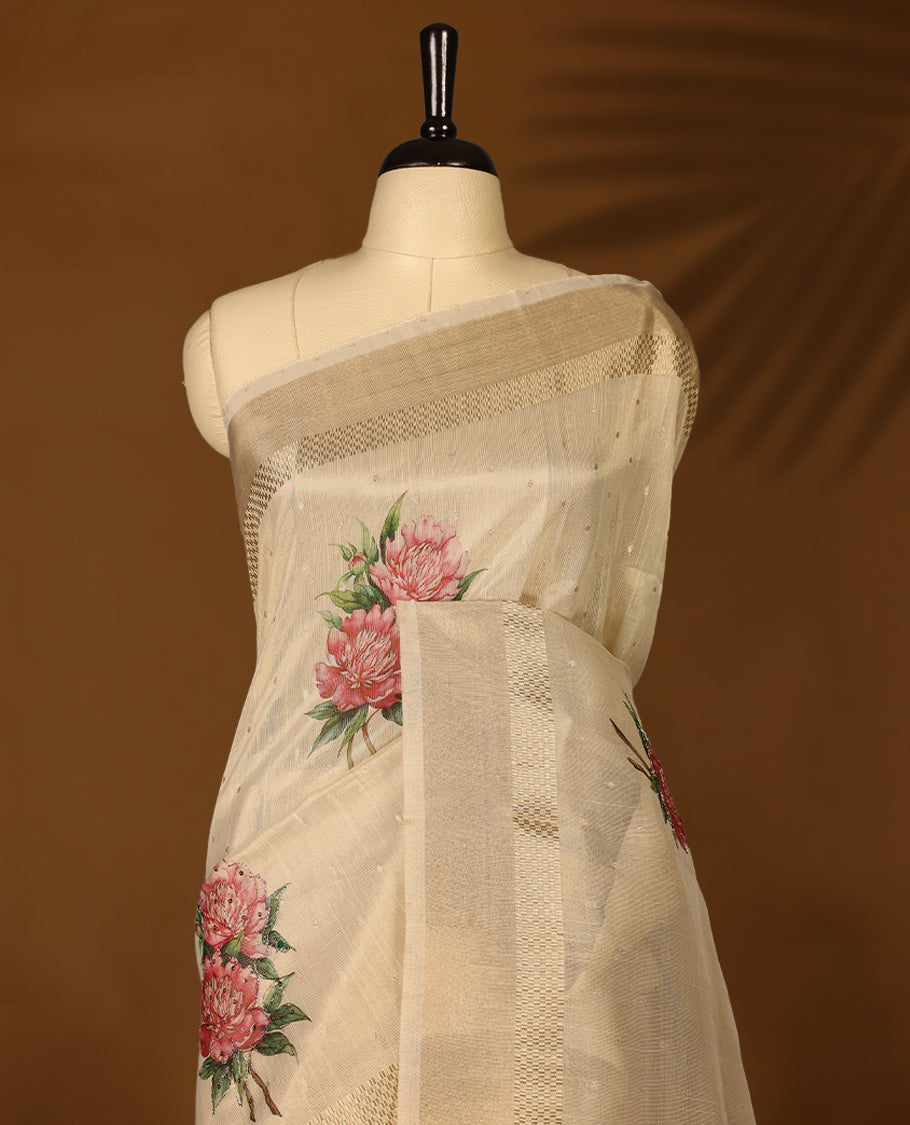 Light gold colour Organza Kerala saree with a sheer, smooth body and soft golden sheen. Accented with a fine zari border and Bold floral motifs on Pallu, Comes paired with a coordinated matching blouse.
