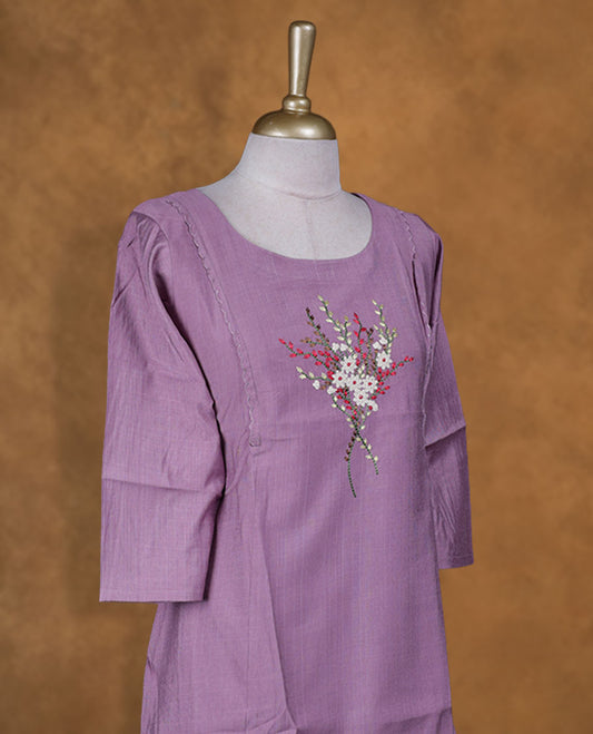 Lavender colour kurti with multicolour floral thread pattern, knee length design, styled with a round neckline and a  sleeve .