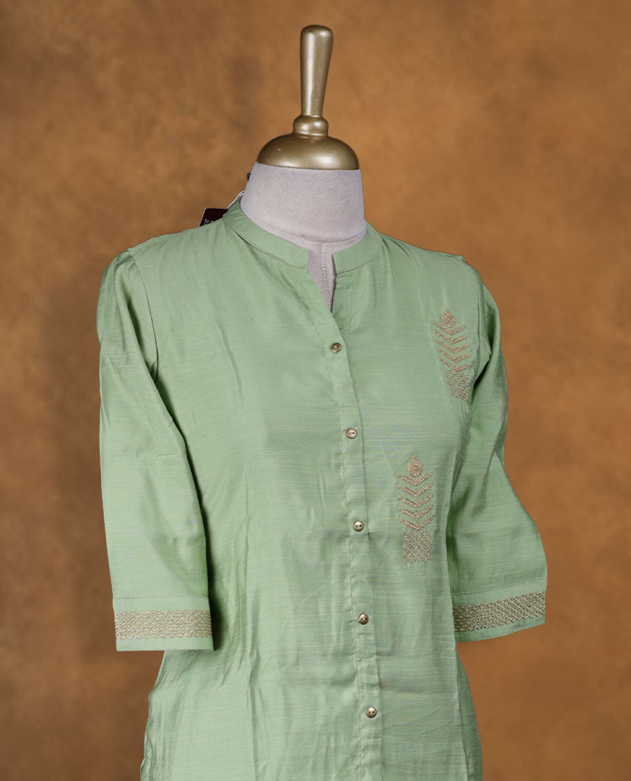 Mint green colour kurti detailed with subtle thread embroidery on the front, styled with a band collar, front button placket and comfy 3/4th sleeves.