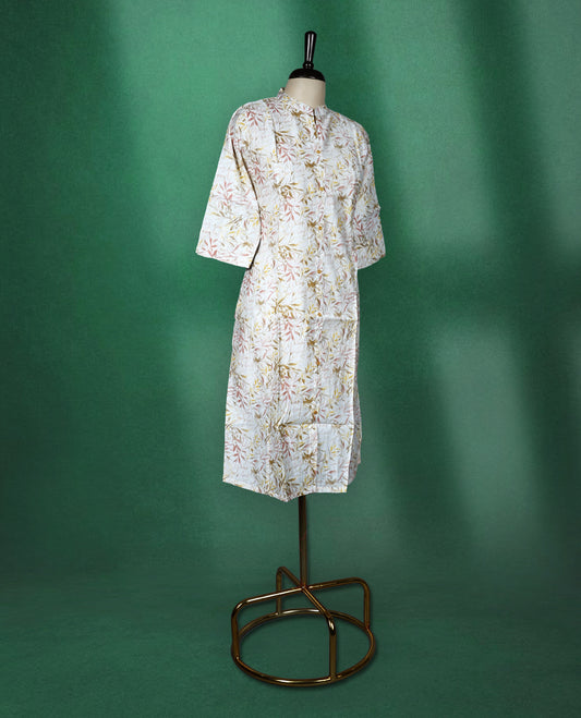 Off white cotton kurti featuring an all over leaf print, styled with a smart mandarin collar, front buttons, and elbow length sleeves perfect for a relaxed, everyday look.