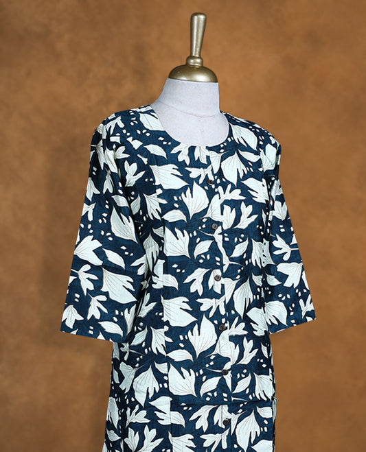 Teal and cream colour kurti with White floral prints, knee length design, styled with a round neckline and a sleeve .
