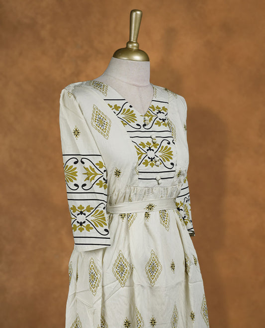Ivory printed knee-length A-line dress with V-neckline, olive and black ethnic motifs, three-quarter sleeves, and a detachable waist belt for a cinched fit.