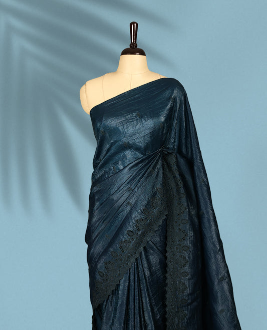 Midnight Blue Colour crush soft silk saree, textured body with a natural crinkled finish, adorned with intricate self colored floral Motifs and complemented by a delicate thread embroidery cutwork border, paired with a matching blouse
