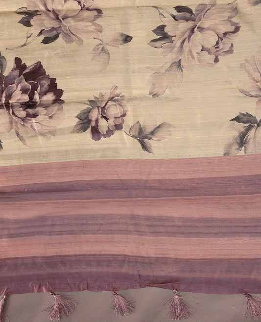 Cream colour semi silk printed saree adorned with printed floral motifs across the body, finished with a onion colour striped border, with matching blouse