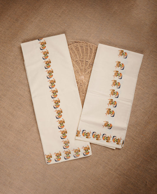 Cream colour cotton set mundu highlighting Indian culture printed pattern border.