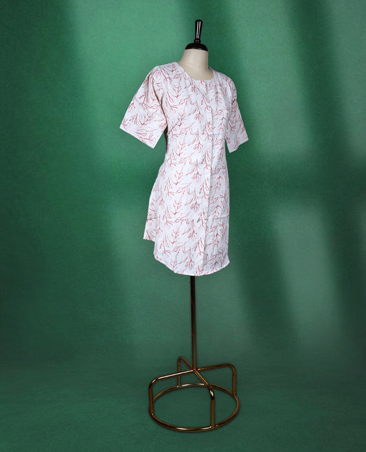 Beige colour cotton kurti adorned with delicate red leaf prints, featuring a round neckline, short sleeves, and a straight cut silhouette a breezy and elegant pick for casual and daily wear.