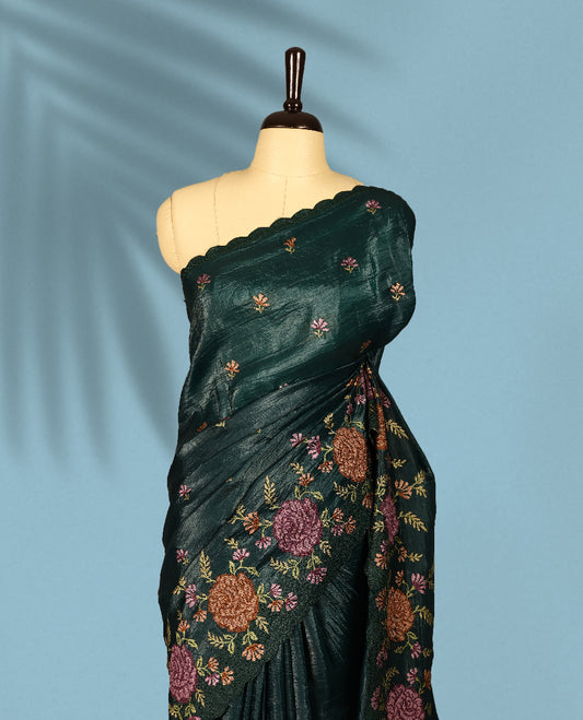 Deep Sea Green Colour crush soft silk saree, textured body with a natural crinkled finish, adorned with intricate Multi colored floral Motifs and complemented by a delicate Multi Colour Bold Floral embroidery border, paired with a matching blouse