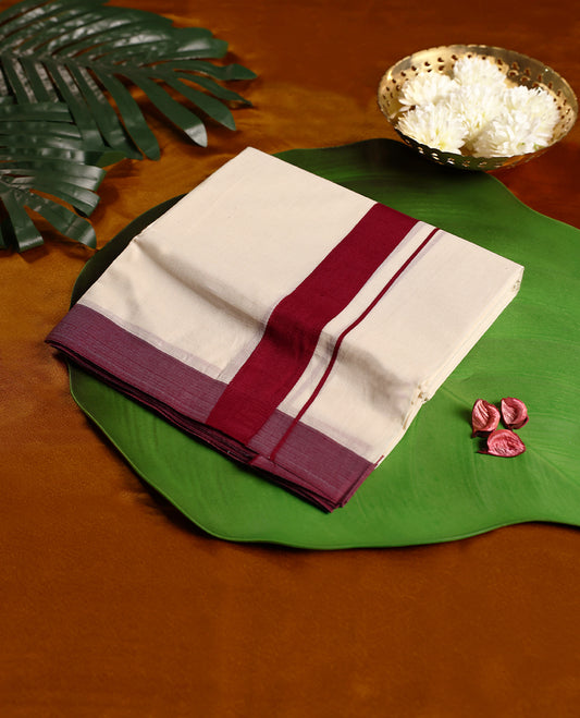 Off white colour cotton double dhoti featuring a striking maroon kara with subtle edging, crafted for traditional grace and everyday comfort, perfect for cultural gatherings and festive occasions.