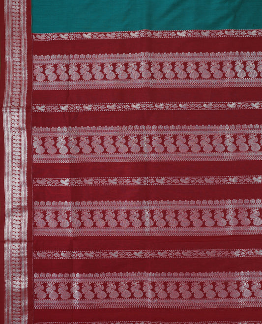 Peacock Blue colour mixed Kalyani cotton saree featuring Silver zari peacock motifs throughout the body, paired with a Maroon colour traditional border and pallu, with matching blouse